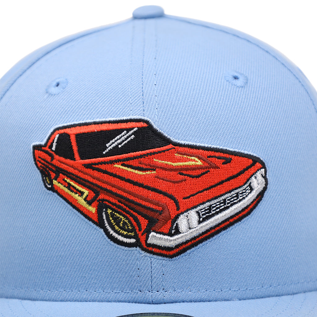 front closeup view of sky blue Fresno Grizzlies Lowriders fitted hat showing the red lowrider classic car logo
